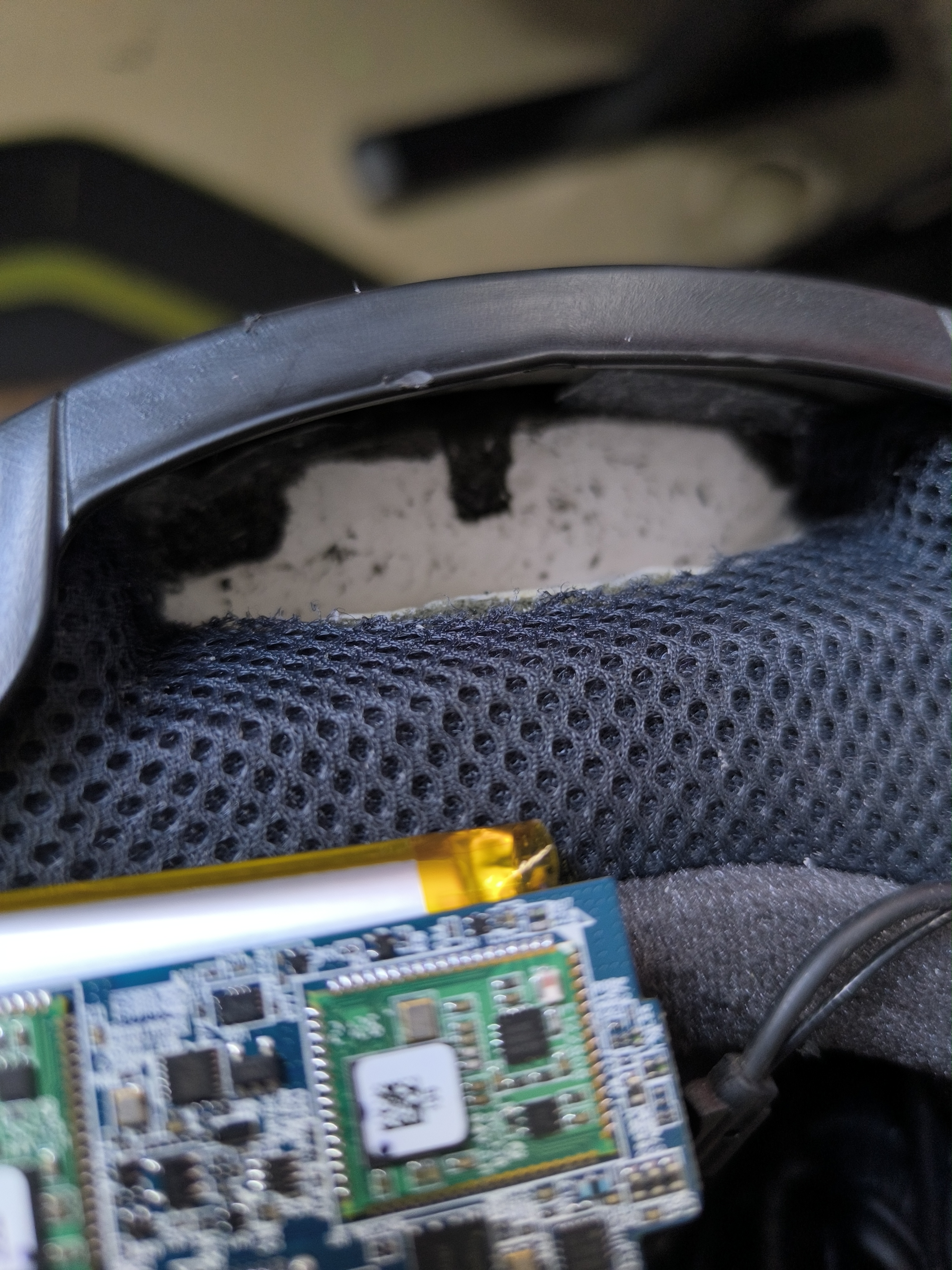 The white foam inside the helmet recess, surrounded by black trim and fabric padding.